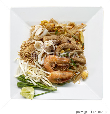 Top view of Pad Thai seafood and pork noodles on square plate isolated on white background Top view of Pad Thai seafood and pork noodles on square plate isolated on white background 142106500