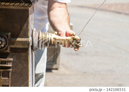 Close-up of a Hand Spout of Fountain to Drink Fresh Water in Europe street Close-up of a Hand Spout of Fountain to Drink Fresh Water in Europe street 142106531