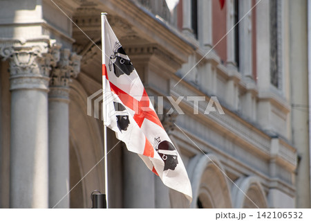 Sardinia Four Moors Flag Waving on Old Historic Building Facade 142106532