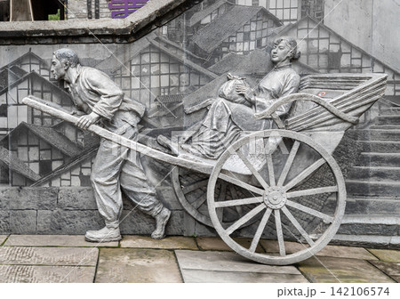 Historical Stone Bas-Relief Depicting Early 20th-Century Transportation of Traditional Chongqing Rickshaw Puller. 142106574