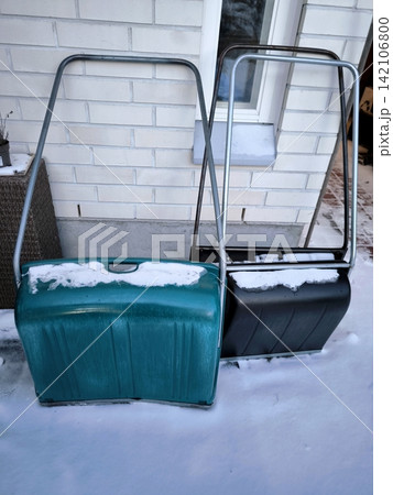 Two plastic shovels for clearing snow around the house Two plastic shovels for clearing snow around the house 142106800