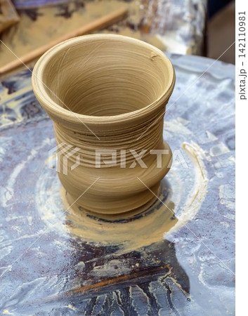 Handmade Clay Pot on Pottery Wheel 142110981