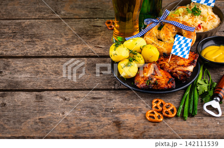 Oktoberfest food: beer, pretzel, sausages, stewed cabbage, potato Oktoberfest food: beer, pretzel, sausages, stewed cabbage, potato 142111539