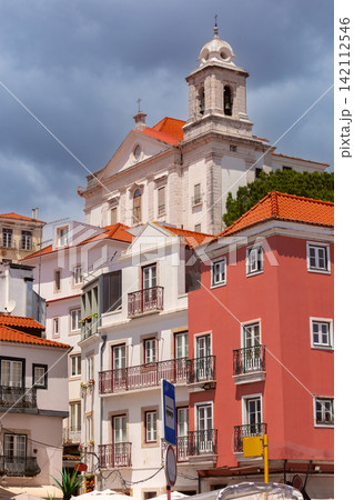 Colorful Historic Houses and Church Tower in Lisbon, Portugal Colorful Historic Houses and Church Tower in Lisbon, Portugal 142112546