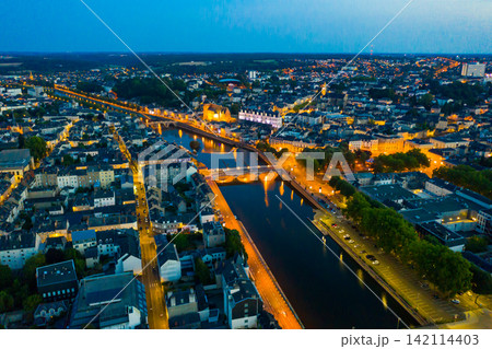 Evening aerial view of Laval with buildings, river Mayenne and old bridge 142114403