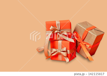 Thanksgiving day. Three autumn-wrapped gift boxes await Thanksgiving Day Thanksgiving day. Three autumn-wrapped gift boxes await Thanksgiving Day 142115817