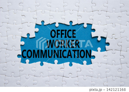 Office Worker Communication symbol. White puzzle with words Office Worker Communication. Beautiful blue background. Business concept. Copy space. 142121168