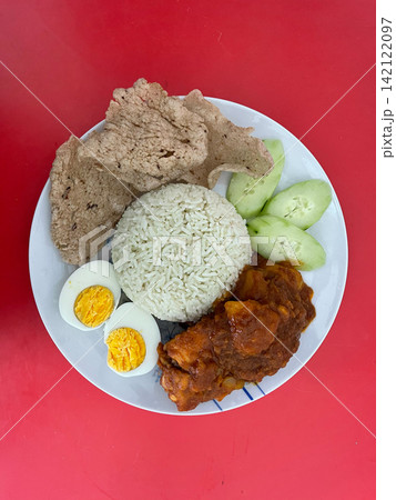 Nasi Lemak With Malaysian Spicy Tomato Chicken And Shrimp Crackers Nasi Lemak With Malaysian Spicy Tomato Chicken And Shrimp Crackers 142122097