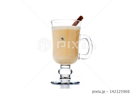 Christmas eggnog with cinnamon stick 142125908