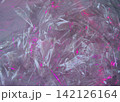 Cyberpunk aesthetic crumpled plastic texture with neon pink light 142126164
