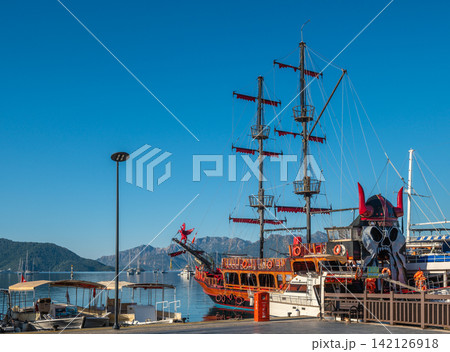 Wooden tourist boats moored at Marmaris embankment in Turkey Wooden tourist boats moored at Marmaris embankment in Turkey 142126918