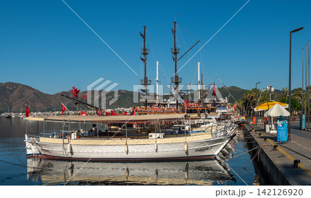 Wooden tourist boats moored at Marmaris embankment in Turkey Wooden tourist boats moored at Marmaris embankment in Turkey 142126920