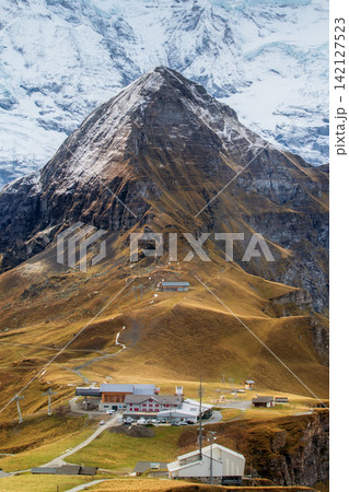 Mannlichen Wengen Bernese Oberland Swiss Alps Switzerland alpine mountain station and hotel and snow covered Jungfrau glacier Mannlichen Wengen Bernese Oberland Swiss Alps Switzerland alpine mountain station and hotel and snow covered Jungfrau glacier 142127523