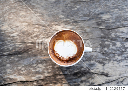 Closeup of cappuccino on dark old grunge with top view 142129337
