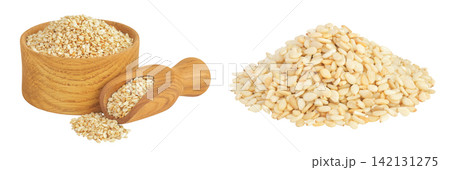 Sesame seeds in wooden bowl and scoop isolated on white background Sesame seeds in wooden bowl and scoop isolated on white background 142131275