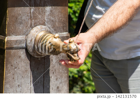 Hand Spout of Fountain to Drink Fresh Water in Europe street Hand Spout of Fountain to Drink Fresh Water in Europe street 142131570