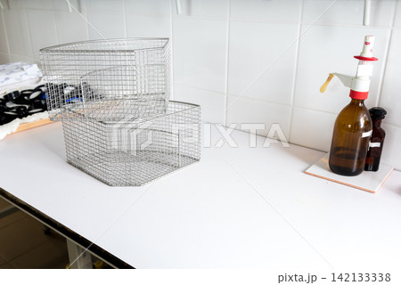 metal wire baskets and mesh trays in laboratory workspace metal wire baskets and mesh trays in laboratory workspace 142133338