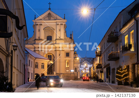 Winter evening, facade of St. Teresas Church in Vilnius Winter evening, facade of St. Teresas Church in Vilnius 142137130