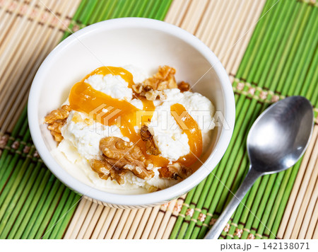 Mato cheese with honey and walnuts 142138071
