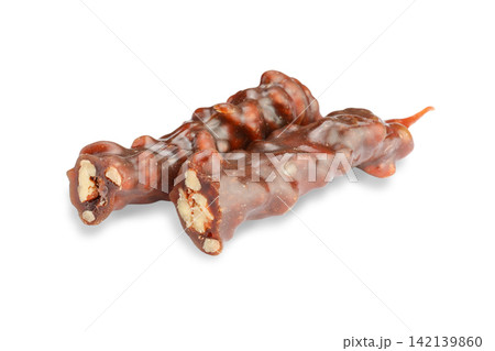 Nuts are coated in grape juice, forming delicious Churchkhela candies, PNG 142139860