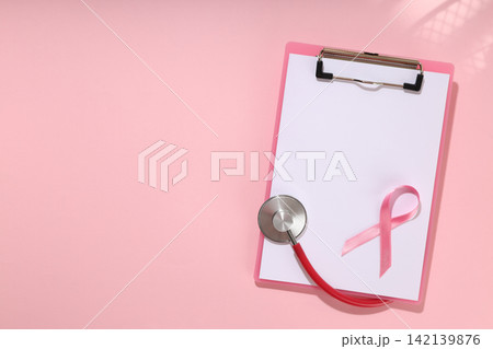 Pink clipboard with blank sheet and stethoscope Pink clipboard with blank sheet and stethoscope 142139876