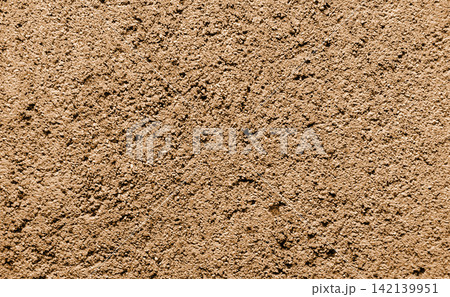 Rough, brown sandstone wall texture Rough, brown sandstone wall texture 142139951