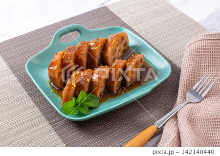 chinese Sweet Rice Stuffed Lotus Root Dessert Dish chinese Sweet Rice Stuffed Lotus Root Dessert Dish 142140440
