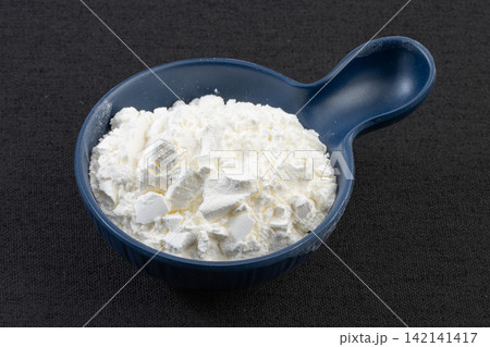 potato Starch Powder on Wooden Spoon Close Up potato Starch Powder on Wooden Spoon Close Up 142141417