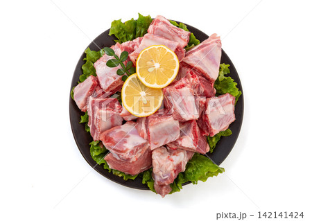 fresh Raw Pork Ribs Cutlets with Lemon 142141424