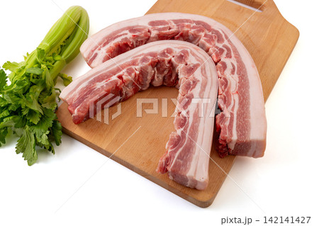 raw Pork Belly with Rib Bones and Celery raw Pork Belly with Rib Bones and Celery 142141427