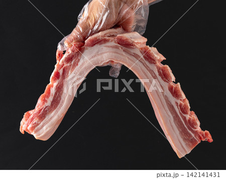 raw Pork Belly with Rib Bones and Celery raw Pork Belly with Rib Bones and Celery 142141431