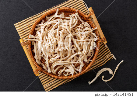 dried Radish Strips Cut in Woven Basket dried Radish Strips Cut in Woven Basket 142141451