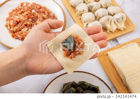 handmade Wonton Making Ingredients with Century Egg and Minced Pork handmade Wonton Making Ingredients with Century Egg and Minced Pork 142141474