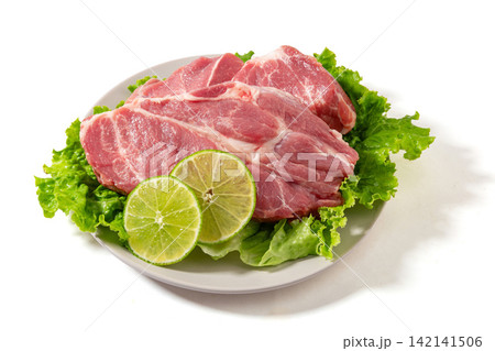 raw Pork Collar Steaks with Lime Slices raw Pork Collar Steaks with Lime Slices 142141506