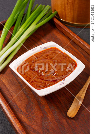savory Brown Sauce Paste in Blue Ceramic Bowl savory Brown Sauce Paste in Blue Ceramic Bowl 142141603