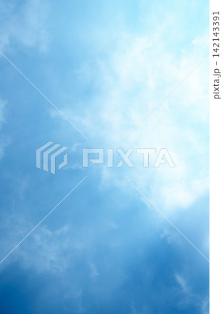 Serene light blue sky with soft, wispy white clouds, creating a peaceful and airy background. Sky or natural background Serene light blue sky with soft, wispy white clouds, creating a peaceful and airy background. Sky or natural background 142143391