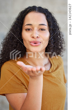 Woman, portrait and blowing a kiss for flirting, love and romance with cute gesture for relationship. Confidence, happy and emoji with lips or mouth, emotion and expression of feelings for affection 142143627