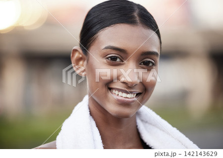 Portrait, woman and fitness with towel outdoor for exercise break, strong body and wellness. Indian female athlete, happy and rest with cloth in park for marathon training, workout and nature running 142143629