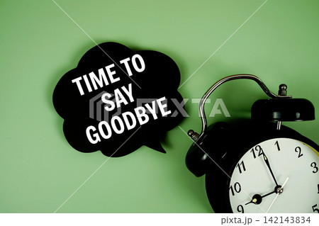 Time to say Goodbye text on speech bubble with alarm clock on green background Time to say Goodbye text on speech bubble with alarm clock on green background 142143834