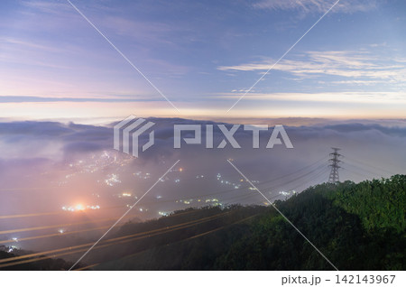 Night View of Rolling Clouds and City Lights from Mountain in Meishan Night View of Rolling Clouds and City Lights from Mountain in Meishan 142143967