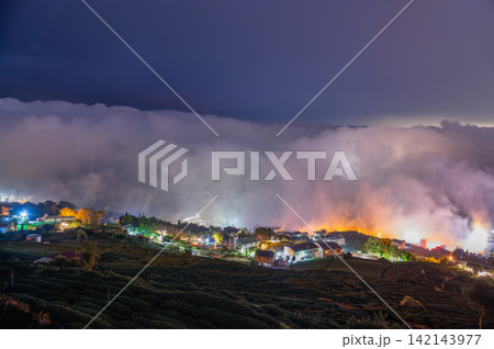 Alishan night view with rolling clouds and tea plantations in Chiayi, Taiwan Alishan night view with rolling clouds and tea plantations in Chiayi, Taiwan 142143977