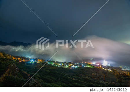 Night View of Shizhuo Tea Plantations and Sea of Clouds in Alishan, Taiwan Night View of Shizhuo Tea Plantations and Sea of Clouds in Alishan, Taiwan 142143989