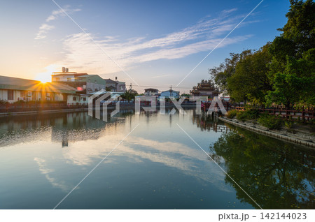 Sunset over river and temple in Tainan, Taiwan Sunset over river and temple in Tainan, Taiwan 142144023
