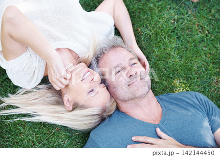 Happy couple, mature and grass or lying relax for relationship date on anniversary, bonding or connection. Man, woman and top view together in New Zealand or garden park for love, resting or summer Happy couple, mature and grass or lying relax for relationship date on anniversary, bonding or connection. Man, woman and top view together in New Zealand or garden park for love, resting or summer 142144450