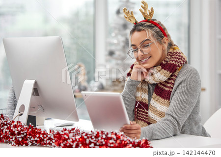Christmas, tablet and happy business woman research, reading email or xmas news in creative startup office. Tech, smile and professional receptionist on internet, website or secretary on holiday app 142144470