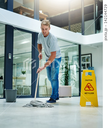 Man, mopping and business office or cleaning hygiene with caution sign or water, soap or bacteria. Male person, janitor and wash service in corporate building at dirty floor or labor, health or germs 142144729