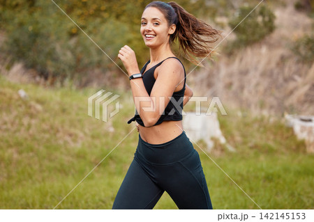 Fitness, nature and portrait of woman running for race, marathon or competition training with smile. Sport, happy and female athlete runner with outdoor cardio exercise for health or wellness workout 142145153