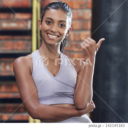 Woman, gym and thumbs up for fitness with sport for health, wellness and training by boxing exercise. Happy, active and female athlete with gesture in portrait for motivation or support with goals 142145163