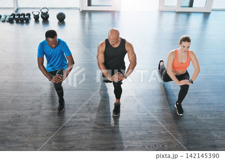 Fitness, instructor and lunges exercise in gym, diversity and people in wellness centre for training and strong leg muscles. Coaching, health and support for workout challenge, active with athletes Fitness, instructor and lunges exercise in gym, diversity and people in wellness centre for training and strong leg muscles. Coaching, health and support for workout challenge, active with athletes 142145390