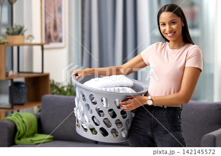 Cleaning, laundry and portrait of girl with basket in home or cleaner working with happiness. Washing, clothes and maid with fresh linen in hotel, hospitality service or help with chores in apartment 142145572